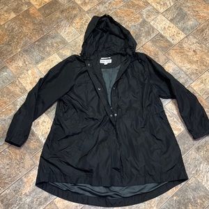 Black windbreaker/rain jacket. Unlined. Lightweight. Waist cinch cord on inside